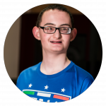 a young teenage boy with glasses